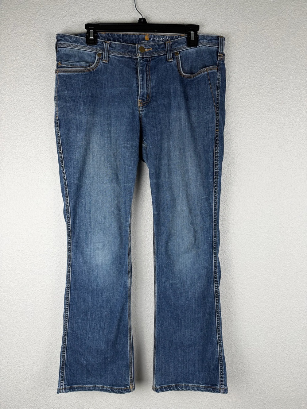 Carhartt Women's Relaxed
Fit Bootcut Jeans in a medium blue wash size 14R
